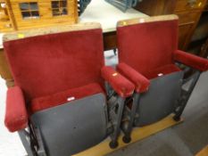 A pair of adjoined fold-up cinema-seats Condition Report: please request* *Condition is not stated