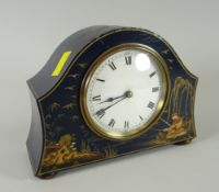 A good antique chinoiserie decorated French wood mantel clock with circular dial on four metallic