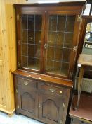 A modern compact dresser with glazed top, two drawers & two cupboards Condition Report: please