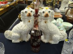 A pair of antique Staffordshire dogs & a ruby-flash wine decanter Condition Report: please