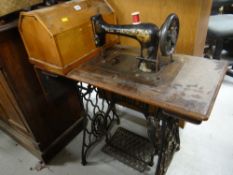 A vintage Singer treadle sewing machine Condition Report: please request* *Condition is not stated