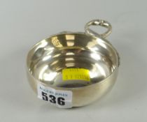 A silver circular dish with ring handle in the form of two serpents, London 1960, 4.4grams Condition