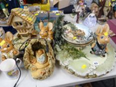 A collection of Pendelfin ornaments including stand, display plates & larger type figures