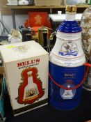 Two commemorative Bell's Scotch whiskey Wade bell decanters (complete with contents) one