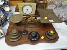 A large set of brass scales with weights on a mahogany base Condition Report: please request* *