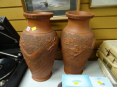 A pair of oversized relief decorated red-ware Oriental style vases Condition Report: please request*