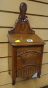 An antique mahogany carved wall-mounted salt-box (possibly French) with base drawer Condition
