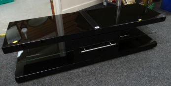 A modern polished black and chrome 'Techlink' TV stand, 130 x 35.5 x 39.5cms Condition Report: