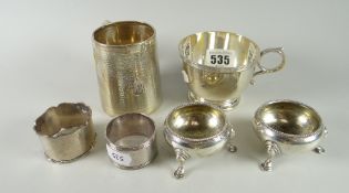 Silver cup, machine-turned silver mug, pair of silver salts & two silver napkin rings, 11.02 Troy oz