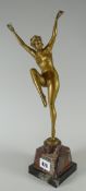 An early twentieth century polished bronze figure of a nude female dancer, circa 1920s, signed by