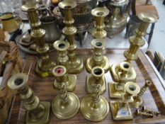 Sundry pairs of brass candlestick holders Condition Report: please request* *Condition is not stated