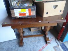 A vintage oak extending dining table on a stretcher base Condition Report: please request* *