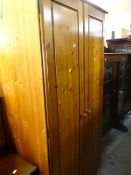 A modern pine two-door wardrobe Condition Report: please request* *Condition is not stated in this