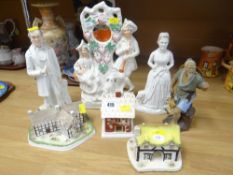 A pair of Staffordshire figures of Mr & Mrs Gladstone, Staffordshire clock group, three Coalport