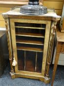 An antique walnut & ebonized single-door music cabinet with inlaid decoration, the architectural
