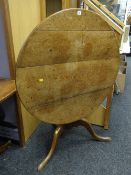 An antique oak circular tilt-top planked tripod table, 96cms diam Condition Report: please