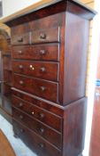 An antique Victorian chest-on-chest composed of six long & two short drawers with carved frieze,