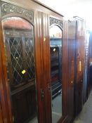 A polished wardrobe, a carved mahogany wardrobe & an open bookcase Condition Report: please request*