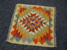 A Choli mat, 50 x 50cms Condition Report: please request* *Condition is not stated in this type of