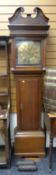 An oak encased antique eight-day longcase clock, the brass dial bearing Roman numerals & two