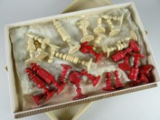 A vintage chocolate box containing antique ivory carved & stained wood chess pieces Condition