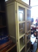 A modern two-door display cabinet / bookcase Condition Report: please request* *Condition is not