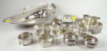 A Sterling Silver marquise shaped swing handled dish & a quantity of silver napkin rings & a small