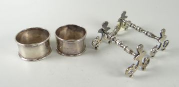 A pair of hallmarked silver knife rests together with two silver hallmarked napkin rings Condition