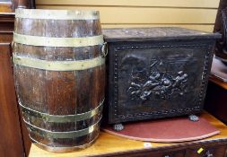 A good relief decorated metal coal box with twin handles & claw feet together with an oval barrel