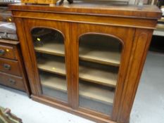 An antique mahogany two-door glazed bookcase Condition Report: please request* *Condition is not