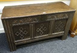 A good early nineteenth century carved oak blanket chest with primitive decoration & of small