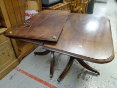 An antique mahogany extending twin-pedestal tripod table Condition Report: please request* *