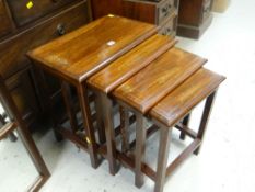 A modern nest of four inlaid hardwood tables Condition Report: please request* *Condition is not