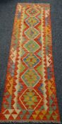 A multi-coloured & patterned vegetable dye wool Choli Kilim runner, 192 x 63cms Condition Report: