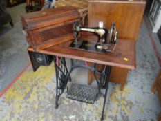 A vintage Singer sewing machine on a cast metal treadle base, Condition Report: please request* *