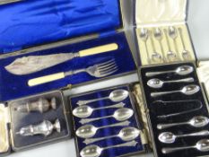A cased pair of silver pepperettes, a cased set of six teaspoons, a cased set of six coffee