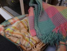 A brightly coloured honeycomb blanket & two further checkered blankets Condition Report: please