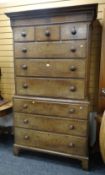 An antique oak & pine chest-on-chest on bracket feet with a base of three graduated drawers, the top