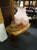 A good nest of three mid-century teak coffee tables together with a vintage polished tapering