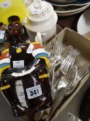 A Trinidad 'Limbo Drummer' rum bottle in the form of figure with hat & a parcel of EPNS cutlery