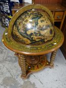 A reproduction terrestrial globe cocktail cabinet Condition Report: please request via email.