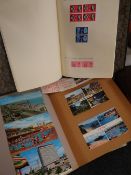 A stamp album & sparsely completed contents together with a scrapbook of vintage postcards Condition