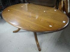 An Ercol or similar darkwood oval coffee table, a nest of three coffee tables & a linen-fold drop-