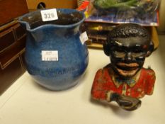 An Ewenny clay pits pottery jug inscribed 'Dwfr Pwr, Rhodd Rhad Duw' & an antique cast iron money