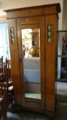 A vintage oak Arts & Crafts-style single-door wardrobe with mirrored & window frontage, 196hx91wx46d