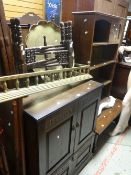 A Long John coffee table, open bookcase with glazed corner section, a linen-fold type cabinet,