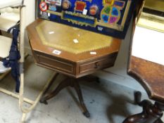 A reproduction tooled leather top tripod table with drawers together with an upholstered chair