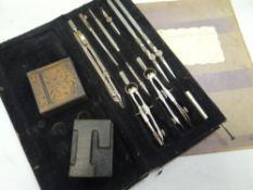 A vintage cased drawing set, stamps & two printing blocks Condition Report: please request via
