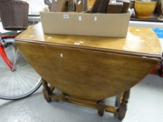 A vintage drop-leaf oak table Condition Report: please request via email. Condition reports not