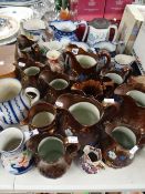 A large collection of antique pottery jugs including copper lustre Condition Report: please